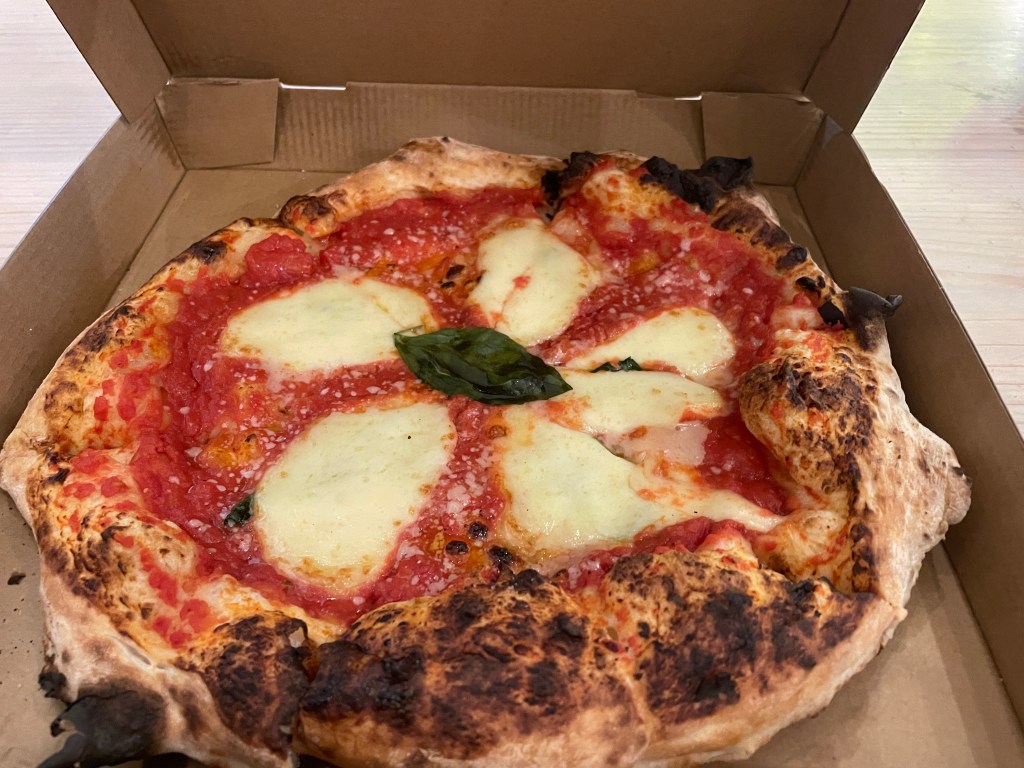woodfire margherita pizza in a takeaway box